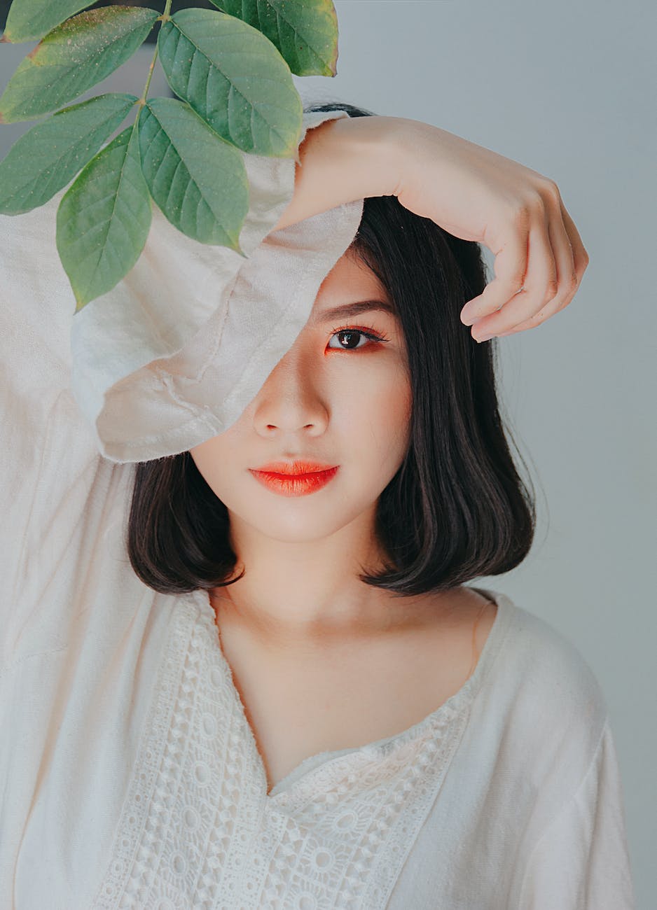 woman in v neck trumpet sleeved dress